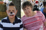 young boy with facepaint with grandmother