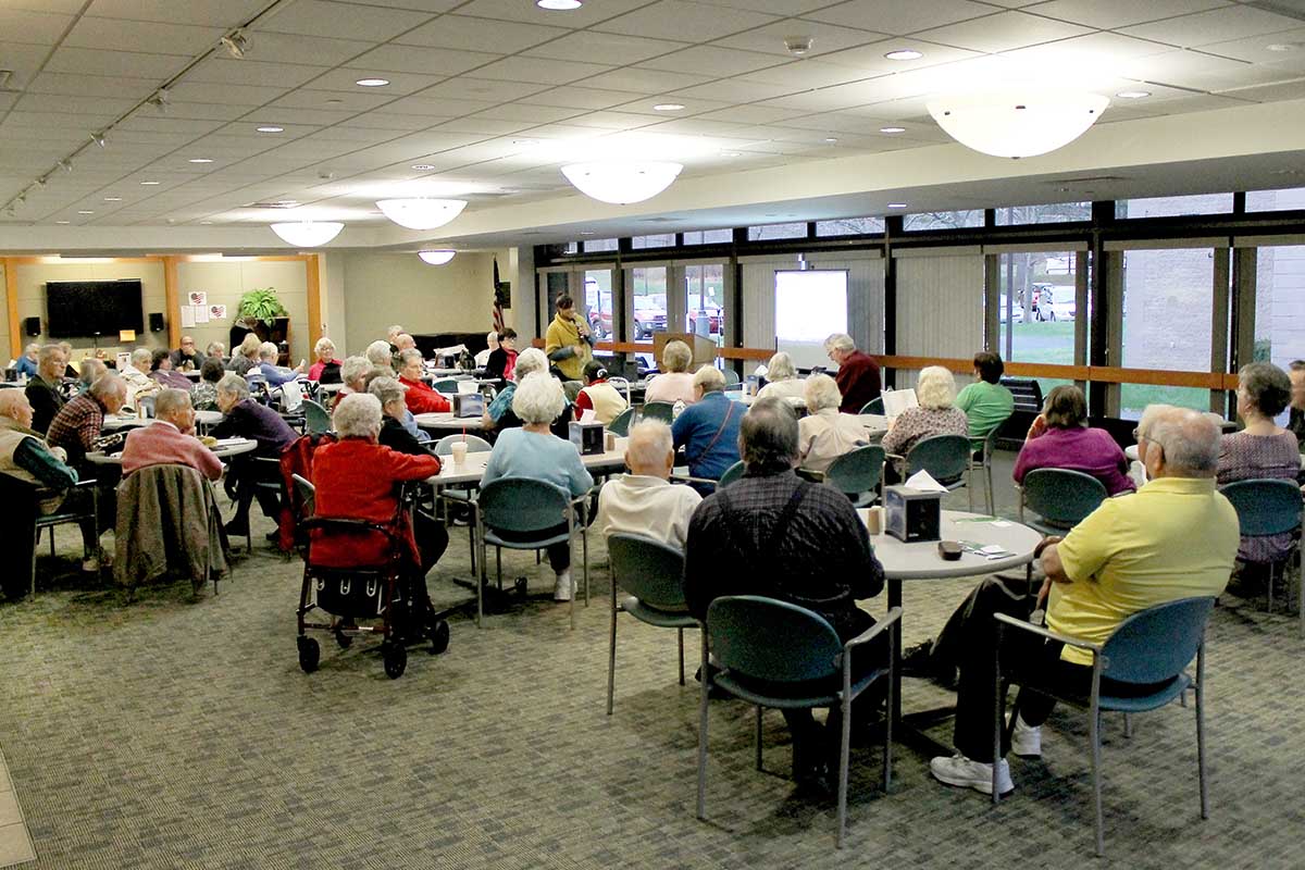 Group of seniors gathered in large room