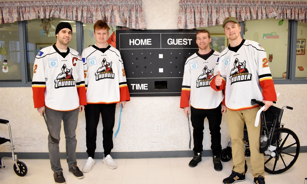 Hockey Players in front of score board