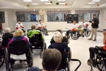 hockey players and residents in wheelchairs
