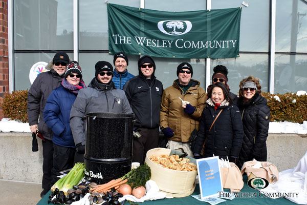 A group photo featuring Wesley staff at our Chowderfest table.