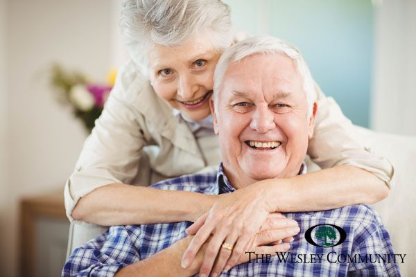 Senior couple embracing and smiling