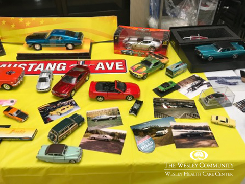Model cars on yellow tablecloth on table