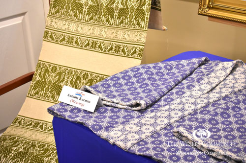 sweater and table runner on display