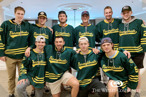 Men's Skidmore hockey team posing for a team photo