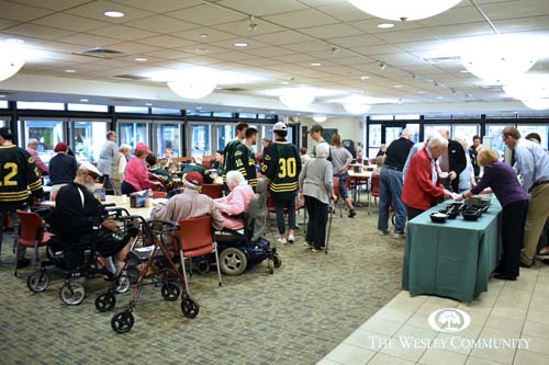 Skidmore hockey team visiting with residents