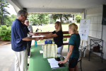 golfers at registration table