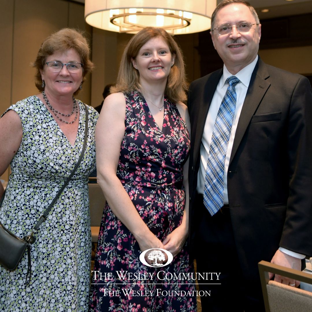 Photo of Beth Brucker-Kane, Helena Mirza, and Dr. Ali Mirza enjoying The Wesley Community Luncheon